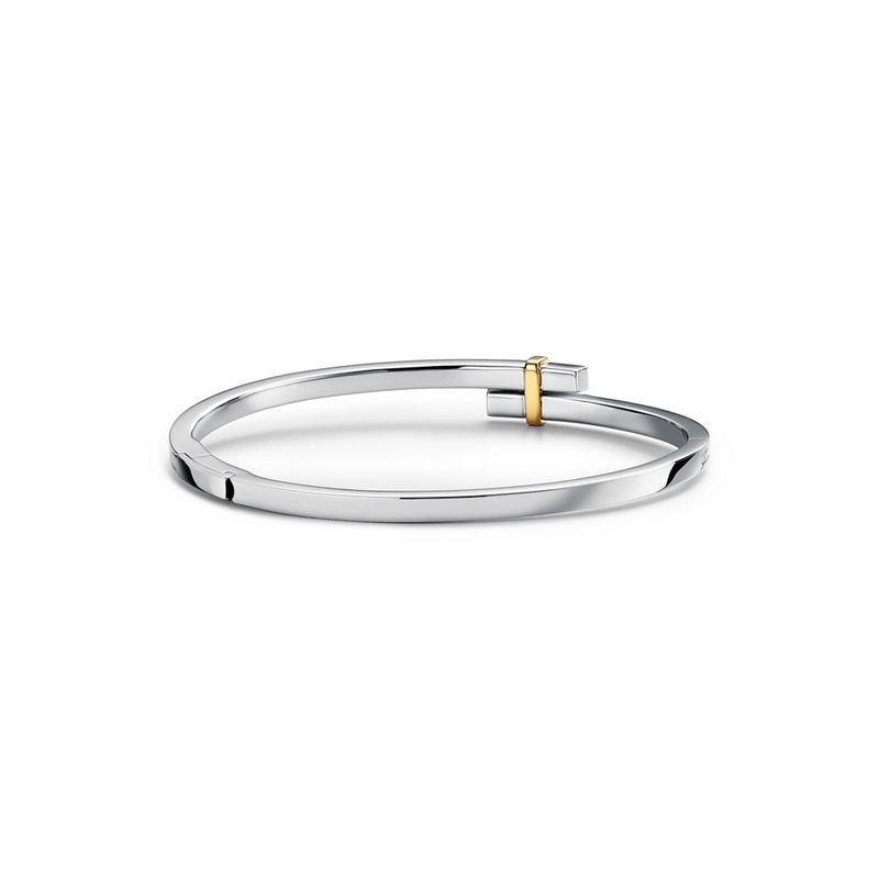 Tiffany & Co. Tiffany Edge Brazalete Hinged Bypass en platino y oro amarillo con diamantes Ahorra y exporta